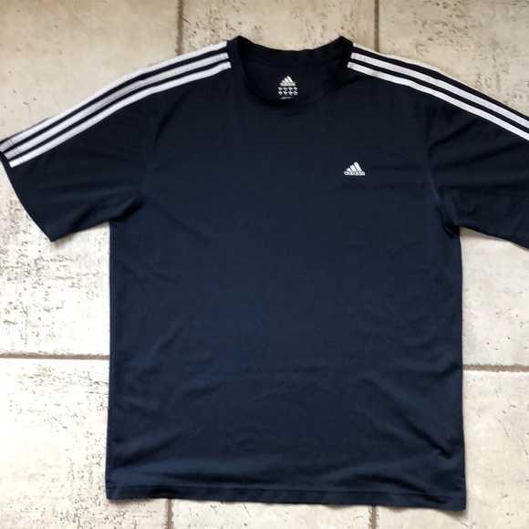 white and navy blue adidas shirt